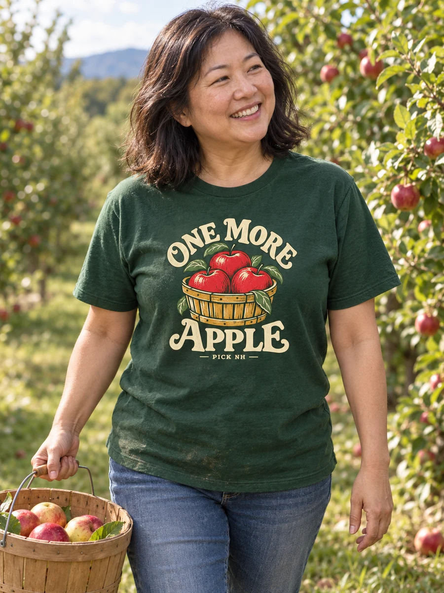 One More Apple concept on a forest green adult shirt in a farm setting